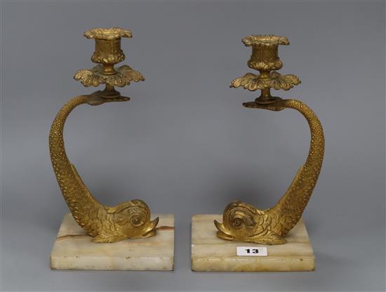 A pair of 19th century ormolu dolphin candlesticks,